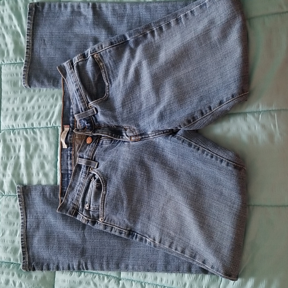 Mid Rise Women's Boot cut Jeans: Sits at Wais